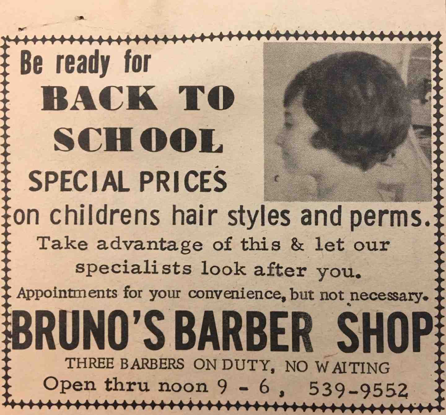 A barbershop ad with a woman who got her hair cut.