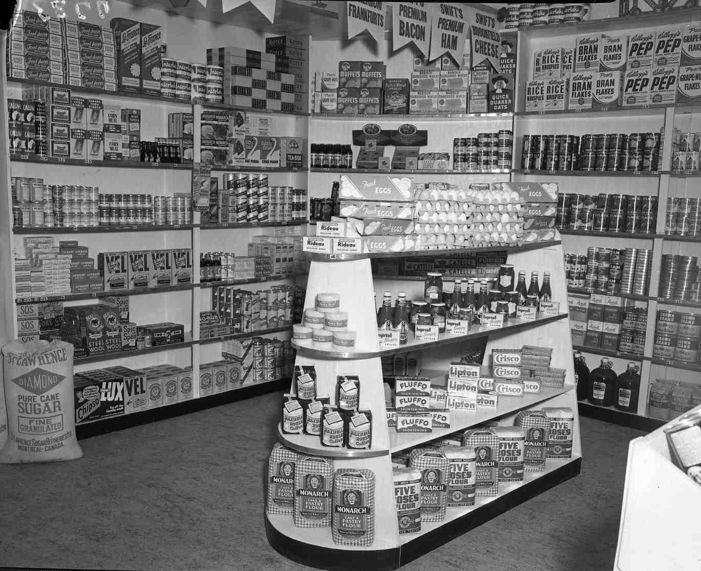 Shelves and displays stocked with food inside a grocery store.