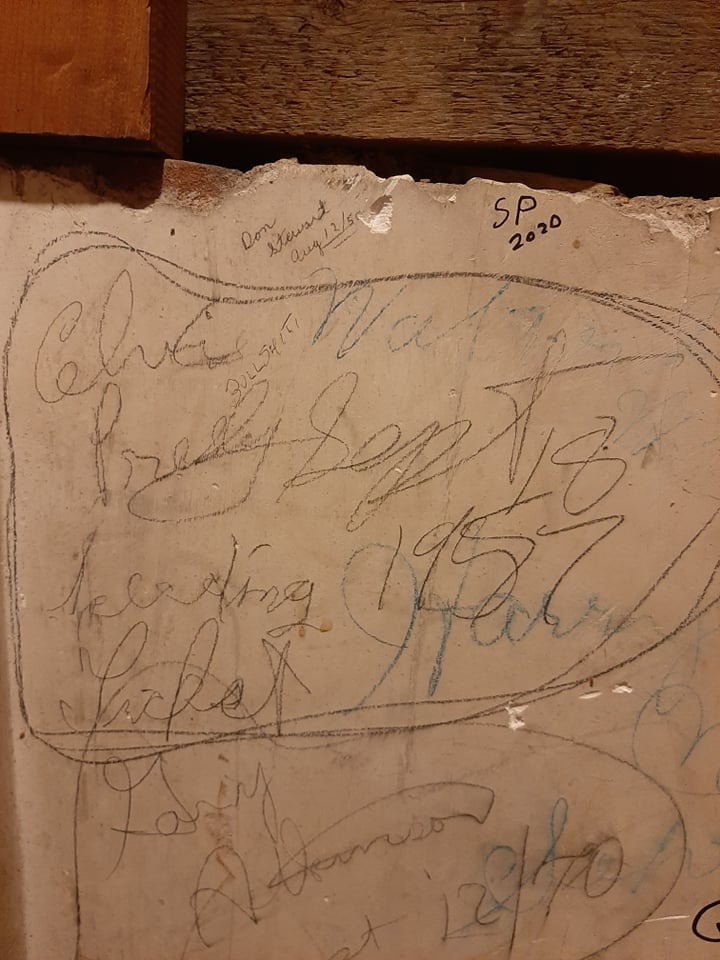 Graffiti featuring an Elvis Presley signature on the unfinished attic walls in the County Courthouse. Dated September 1957.