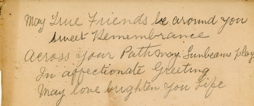 Handwritten note that reads: May true friends be around you, sweet remembrance. Across your path may sunbeams play in affectionate greeting. May love brighten your life.