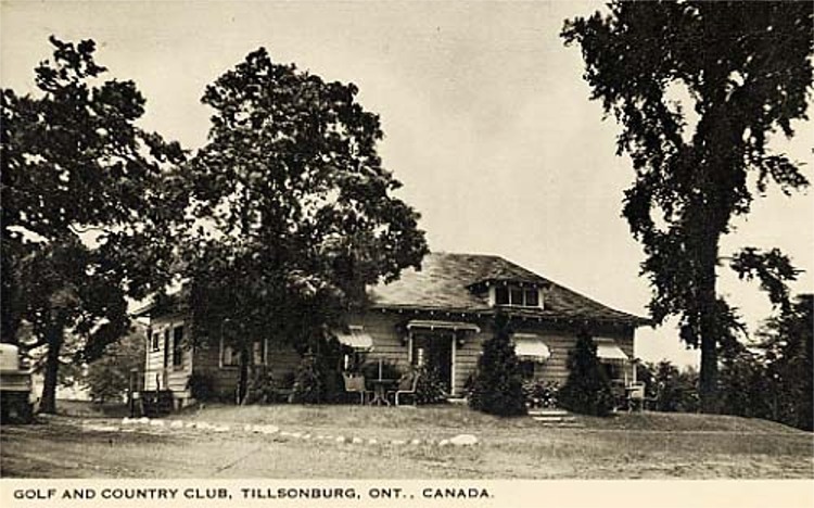 Black and white picture of the Tillsonburg golf and country club. Small one-storey building that looks like a house. Awnings are mounted above the windows.