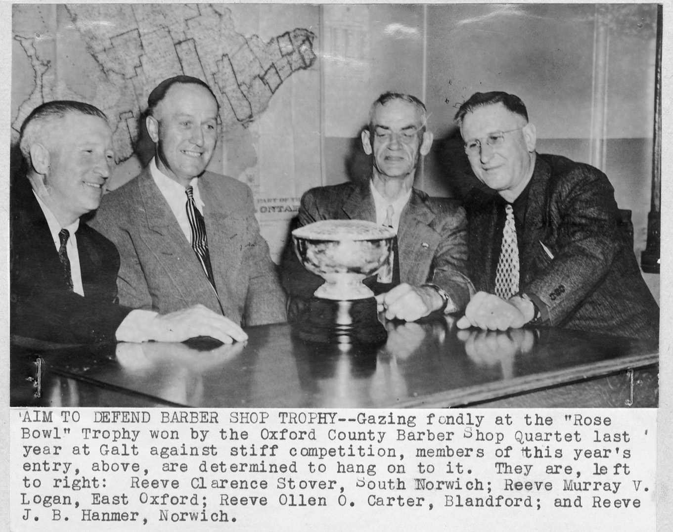 Oxford County Council members posing with the Rose Bowl trophy.