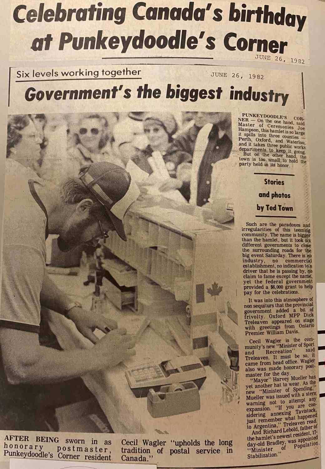 Newspaper article titled Celebrating Canada's birthday at Punkeydoodle's Corner. Photo features Cecil Wagler sworn in as honorary postmaster at Punkeydoodle's Corner.